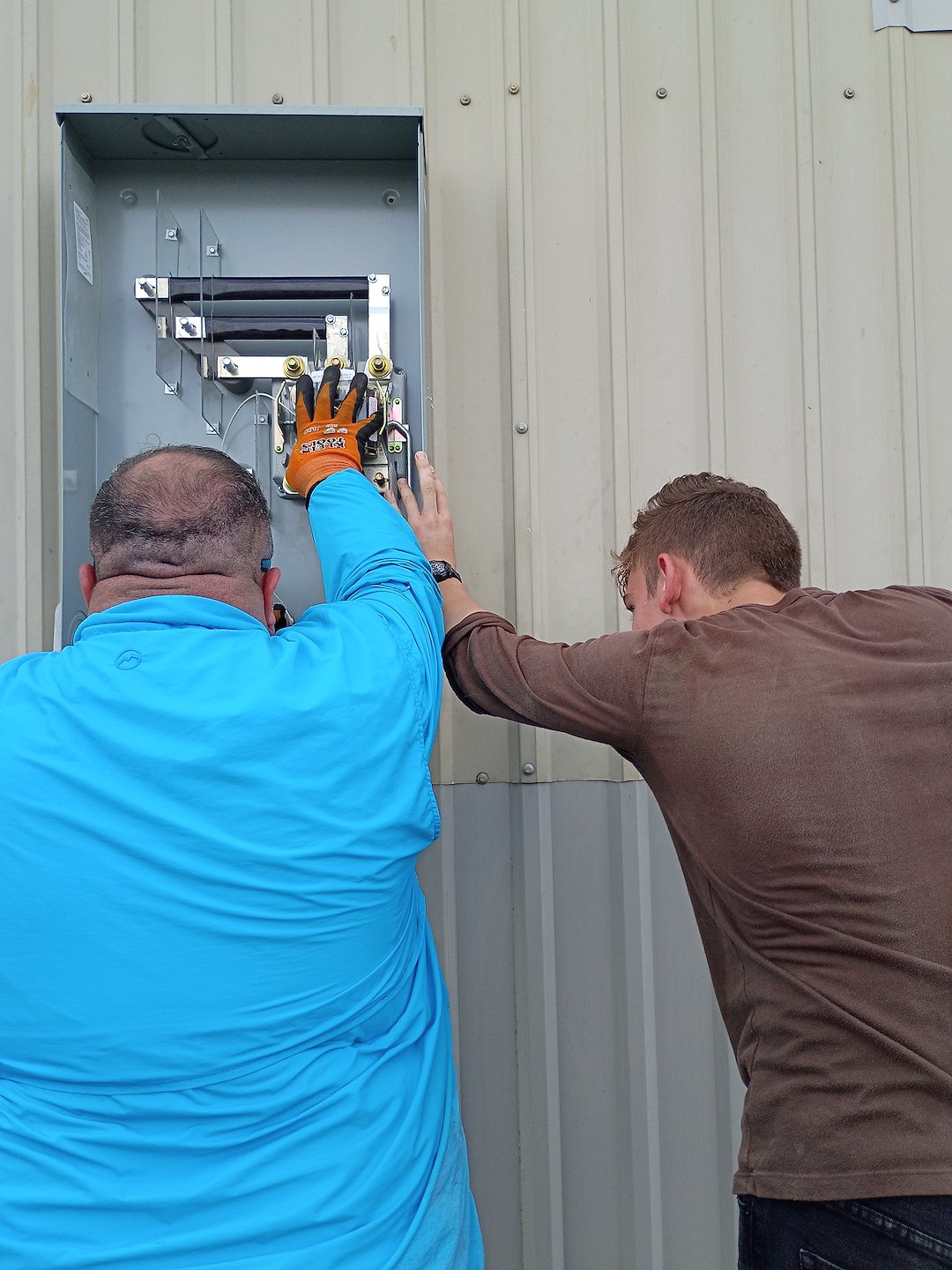 Houmal Electrician Connecting Portable Generators To Panels To Save Homeowners Money